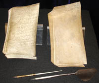 vellum pages, metal pen and shaped bird quill